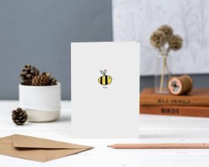 Hand illustrated bee greeting card on white background